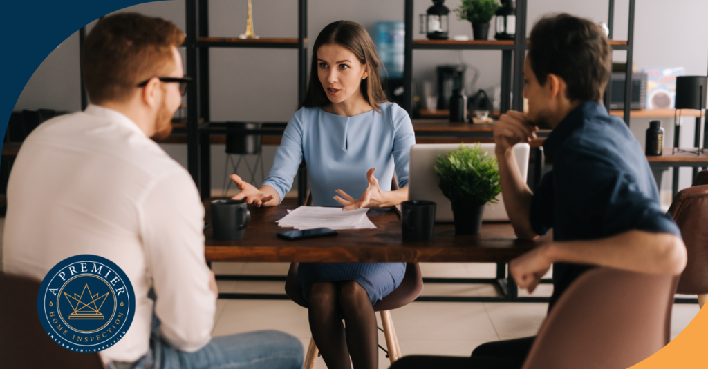 Discussion between home inspection consultant and clients during an informative meeting.