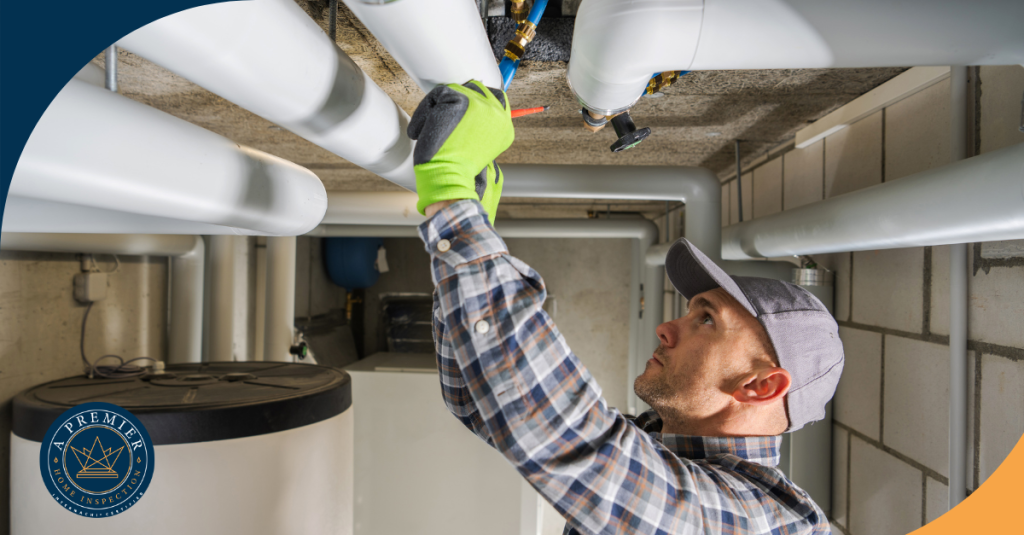 Plumber inspecting pipes in a residential basement system.