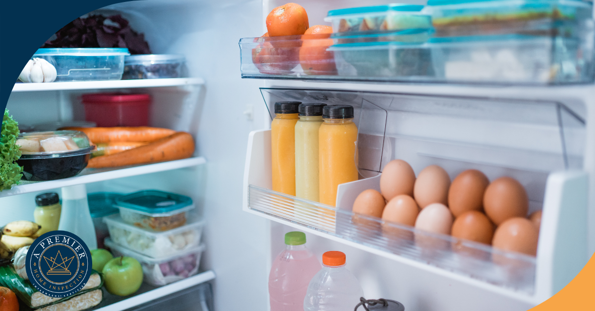Open refrigerator stocked with eggs, juice bottles, fruits, and vegetables.